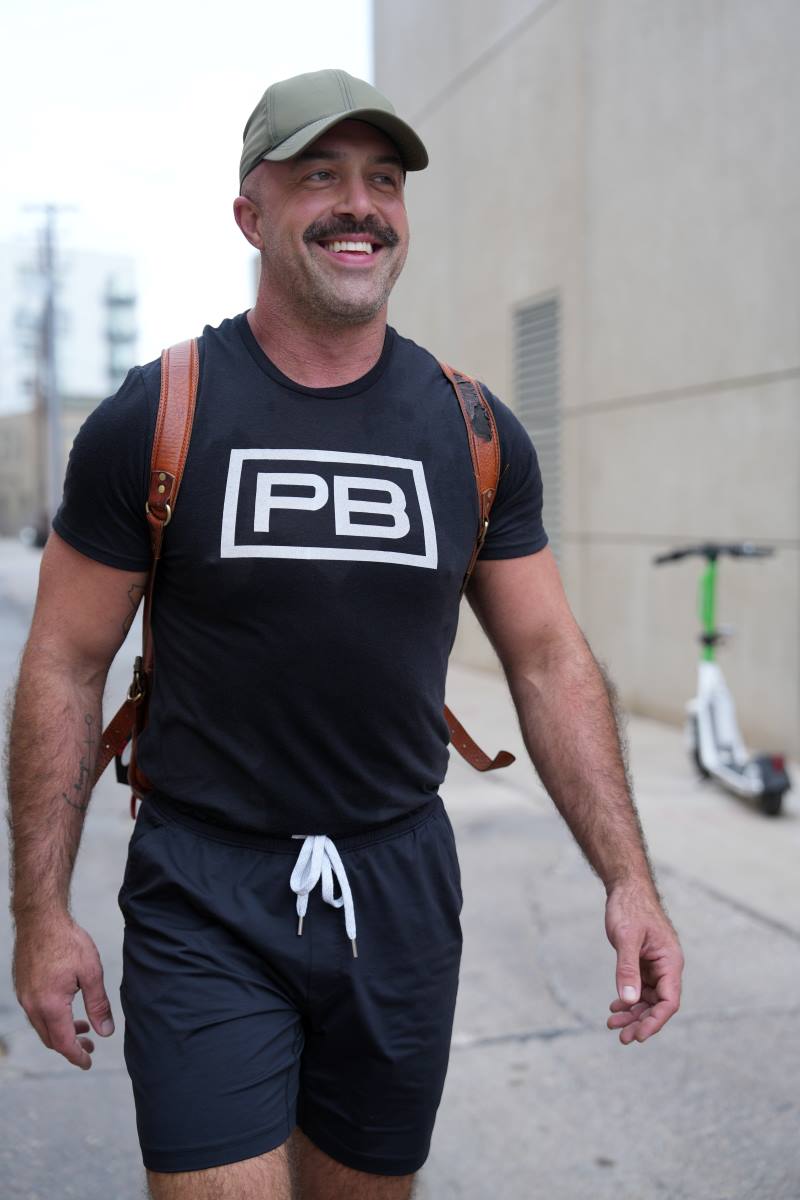 PowerBlock fitness studio's head coach Justin Reis, wearing a black PowerBlock shirt.