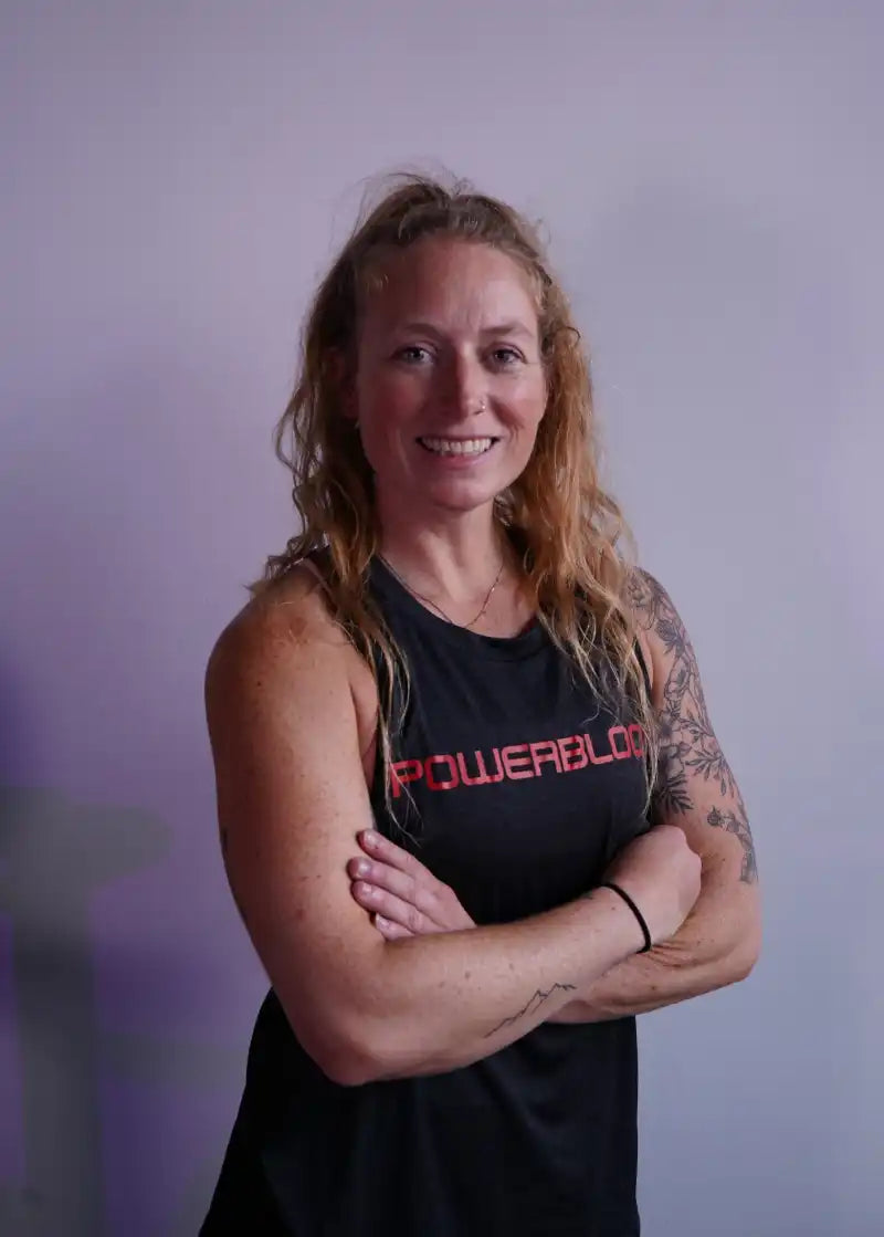 powerblock fitness studio coach Carrie Jones smiling for a headshot photo.