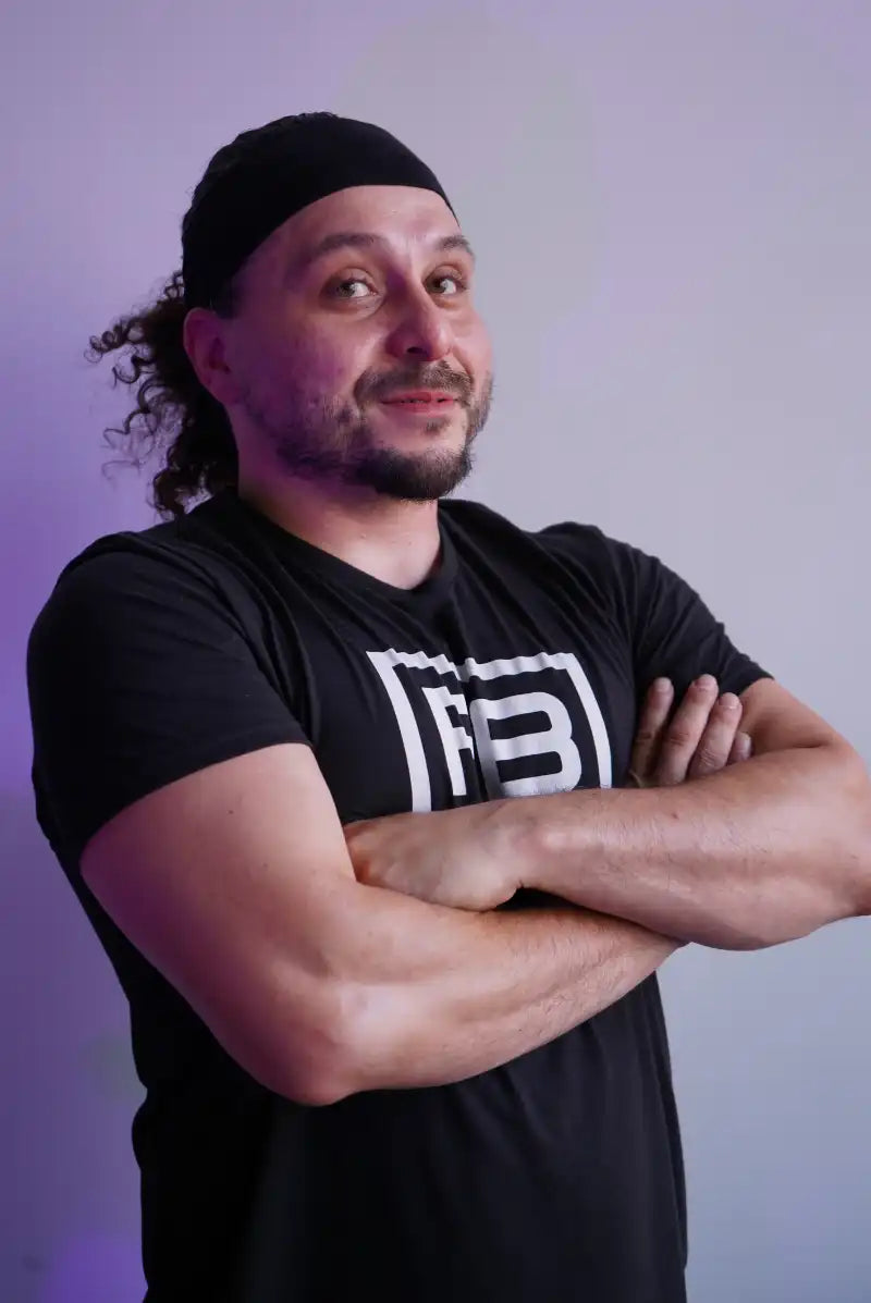 powerblock fitness studio coach Nick Trujillo smiling for a headshot photo.